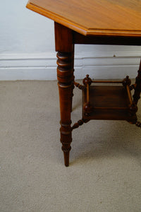 A lovely antique antique Edwardian octagonal shaped occasional table with a lowered shelf