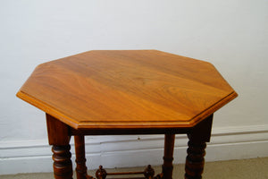 A lovely antique antique Edwardian octagonal shaped occasional table with a lowered shelf