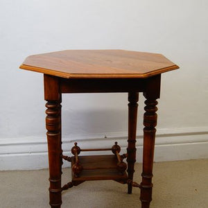 A lovely antique antique Edwardian octagonal shaped occasional table with a lowered shelf