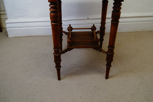 A lovely antique antique Edwardian octagonal shaped occasional table with a lowered shelf