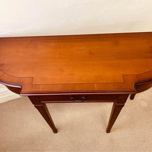 A golden Teak console table made by Strongbow in fantastic condition