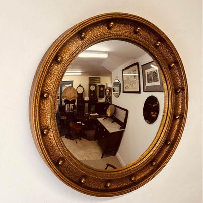 A Regency style gilt framed circular convex butlers mirror in fantastic condition