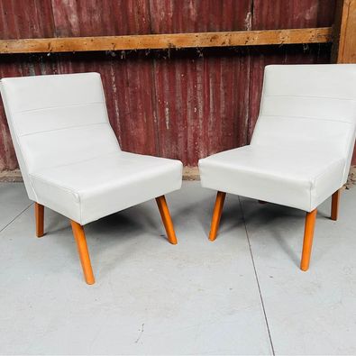 A gorgeous pair of mid century Laidback armchairs