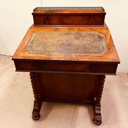 An exquisite vintage mahogany Davenport desk with brass gallery rail to the top