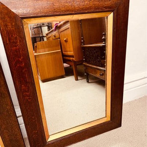 A pair of matching 19th century French oak mirrors with moulded frames