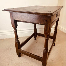 Load image into Gallery viewer, A period oak side table dating from the early 18th century, with a pegged two plank top