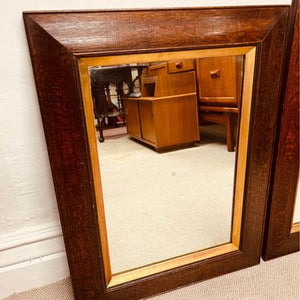 A pair of matching 19th century French oak mirrors with moulded frames