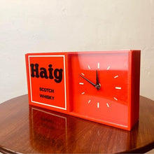 Load image into Gallery viewer, An acrylic Haig Scotch Whiskey wall clock un-used with original packaging