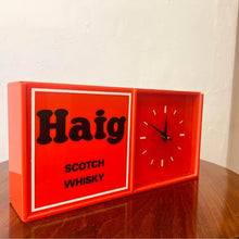 Load image into Gallery viewer, An acrylic Haig Scotch Whiskey wall clock un-used with original packaging