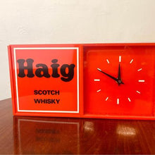 Load image into Gallery viewer, An acrylic Haig Scotch Whiskey wall clock un-used with original packaging