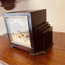 Load image into Gallery viewer, A very decorative Art Deco mantel clock in an ebonised stepped case c1930