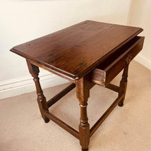 Load image into Gallery viewer, A period oak side table dating from the early 18th century, with a pegged two plank top