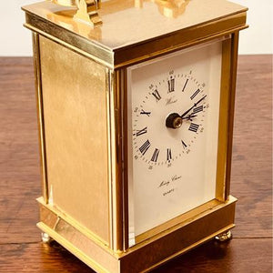 A heavy solid brass melody chime mantle clock