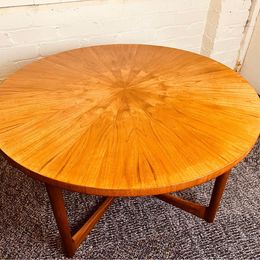 A 1960s vintage sunburst rosewood coffee table by A. H. McIntosh of Kirkcaldy Scotland