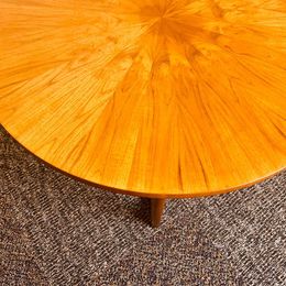 A 1960s vintage sunburst rosewood coffee table by A. H. McIntosh of Kirkcaldy Scotland