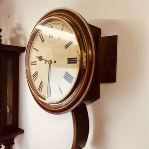 An immaculate large mahogany cased twin Fusee Striking wall clock housed in a mahogany case