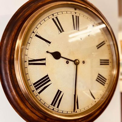 An immaculate large mahogany cased twin Fusee Striking wall clock housed in a mahogany case