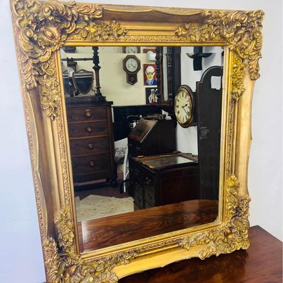 A lovely large vintage design large gilt Rococo wall mirror with double bevelled glass