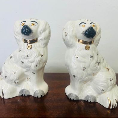 A gorgeous pair of Beswick seated Staffordshire spaniel dogs in lovely condition