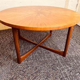 A 1960s vintage sunburst rosewood coffee table by A. H. McIntosh of Kirkcaldy Scotland