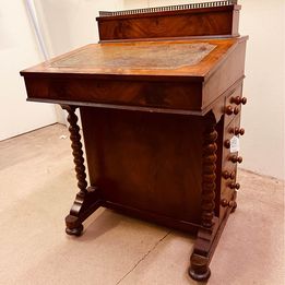 An exquisite vintage mahogany Davenport desk with brass gallery rail to the top