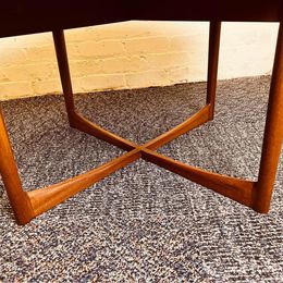 A 1960s vintage sunburst rosewood coffee table by A. H. McIntosh of Kirkcaldy Scotland