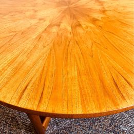 A 1960s vintage sunburst rosewood coffee table by A. H. McIntosh of Kirkcaldy Scotland