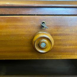 A fabulous mahogany chest of drawers with mother of pearl inlaid drawer knobs