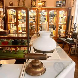 Victorian desk kerosene lamp with white glass shade and original chimney and carrying handle