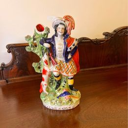 A stunning large Staffordshire flatback figure of "SCOTTISH HIGHLANDER" spill vase