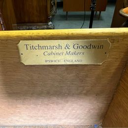 An outstanding solid mellow mahogany serpentine sideboard by renowned 'Titchmarsh and Goodwin'