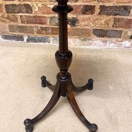 Antique oval mahogany wine table ,the carved piecrust top above a revolving turned stem