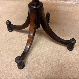 Antique oval mahogany wine table ,the carved piecrust top above a revolving turned stem