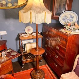 A wonderful mahogany standard reading light with a shelf for your book and Gin & Tonic