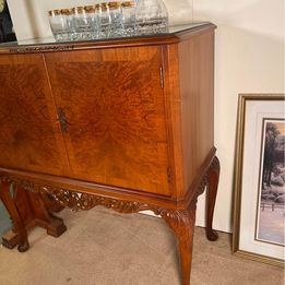 A burr walnut cocktail drinks cabinet with fantastic rich colour