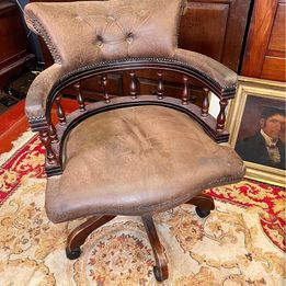 A particularly good vintage leather swivel captains armchair in lovely original condition