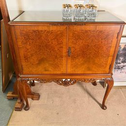 A burr walnut cocktail drinks cabinet with fantastic rich colour