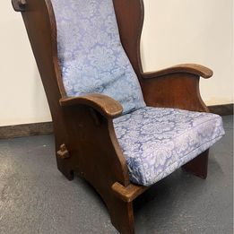 A mid nineteenth century rustic Lambing chair in well patinated oak