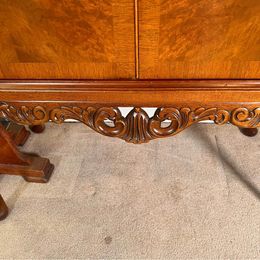 A burr walnut cocktail drinks cabinet with fantastic rich colour