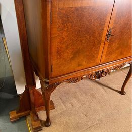 A burr walnut cocktail drinks cabinet with fantastic rich colour