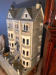 The "Cadogan Gardens" dolls house, built, painted, with deluxe decoration and lit with lighting