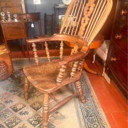 An attractive antique Windsor ash and elm farmhouse elbow chair