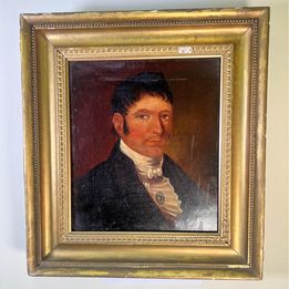 An original 18th century oil on canvas portrait of a handsome gentleman wearing a black jacket