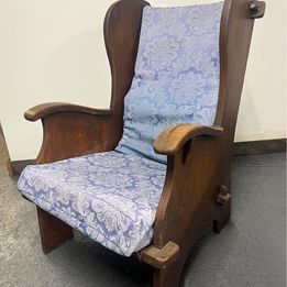 A mid nineteenth century rustic Lambing chair in well patinated oak