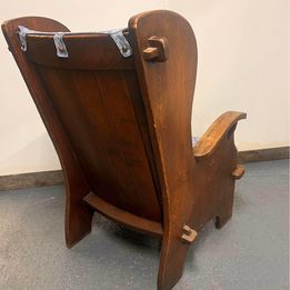 A mid nineteenth century rustic Lambing chair in well patinated oak