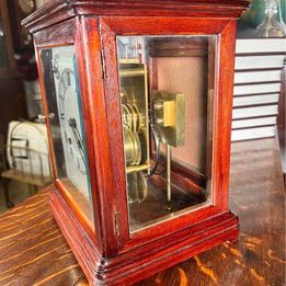 A Fabulous Flame Mahogany Four Glass Library Mantel Clock