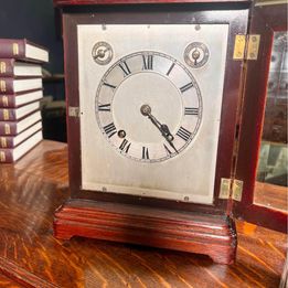 A Fabulous Flame Mahogany Four Glass Library Mantel Clock