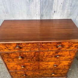 An antique Victorian walnut chest of drawers, faced with burr walnut fronts