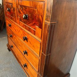 A Victorian Flamed Mahogany Lancashire chest of drawers with mother of pearl handles