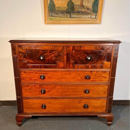 A Victorian Flamed Mahogany Lancashire chest of drawers with mother of pearl handles